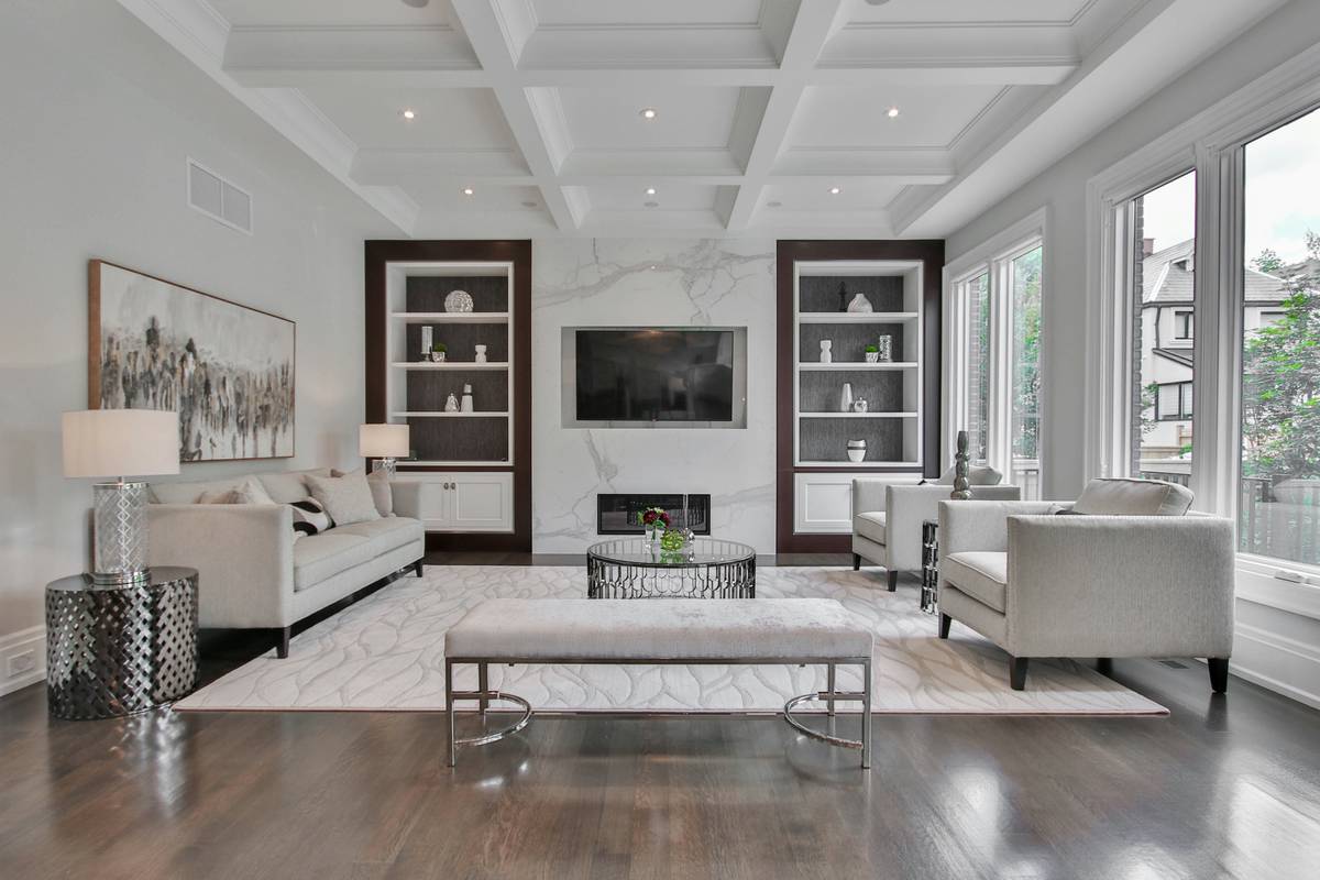 All purpose modular flooring installed seamlessly across a multi-level living space with visible transitions between hardwood, tile, and concrete zones